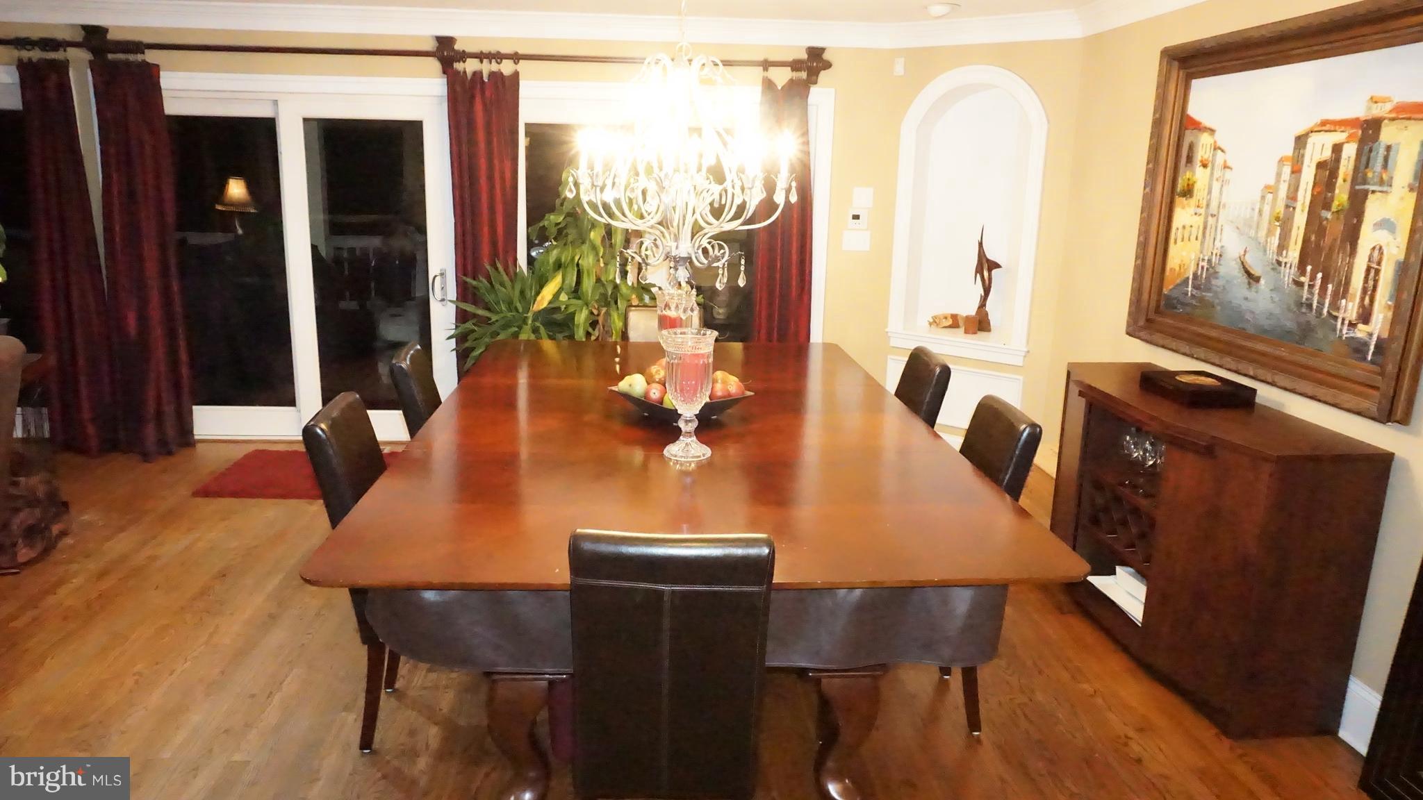 9105 Cuckold Point Road Baltimore, MD 21219 - Photo 7 of 150 a dining room with furniture and wooden floor