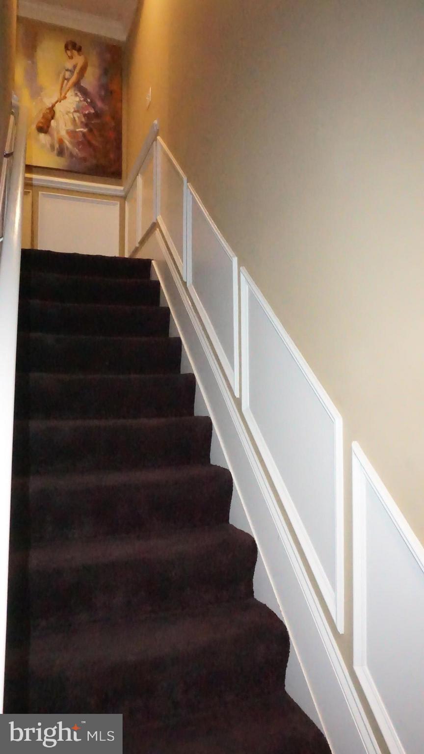 9105 Cuckold Point Road Baltimore, MD 21219 - Photo 78 of 150 Staircase to upper level with wainscoting