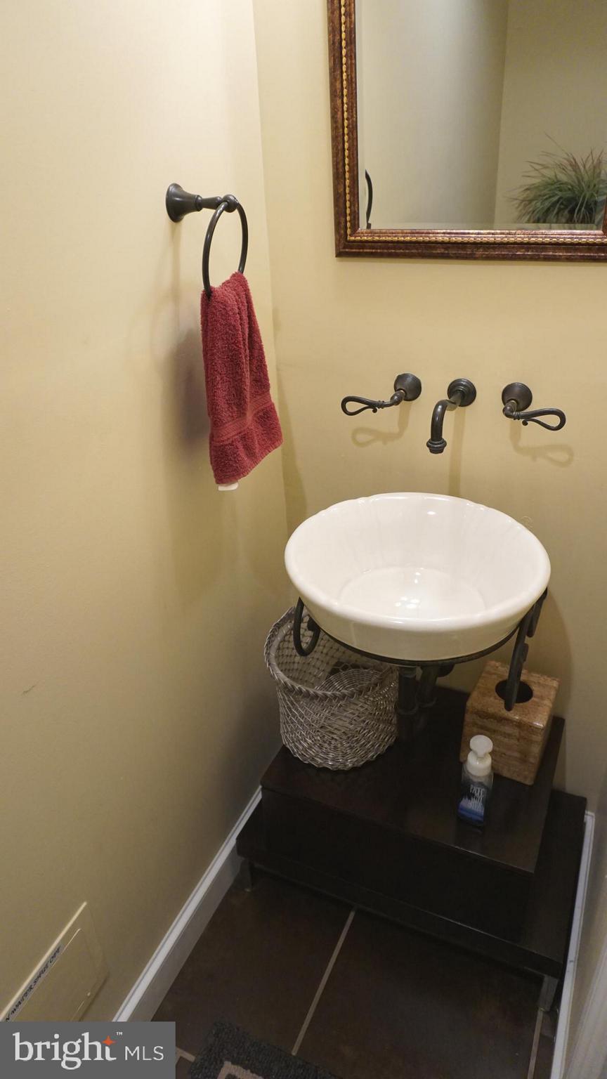 9105 Cuckold Point Road Baltimore, MD 21219 - Photo 88 of 150 Lower level half bath w/vessel sink
