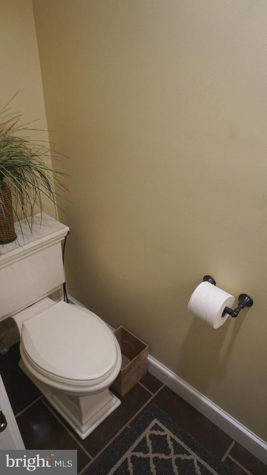 9105 Cuckold Point Road Baltimore, MD 21219 - Photo 90 of 150 a white toilet sitting next to a shower