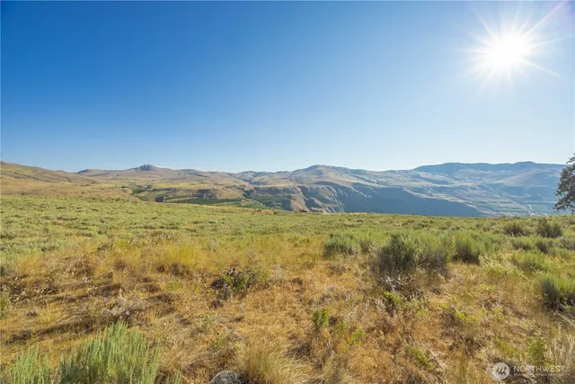 a view of mountain and an ocean