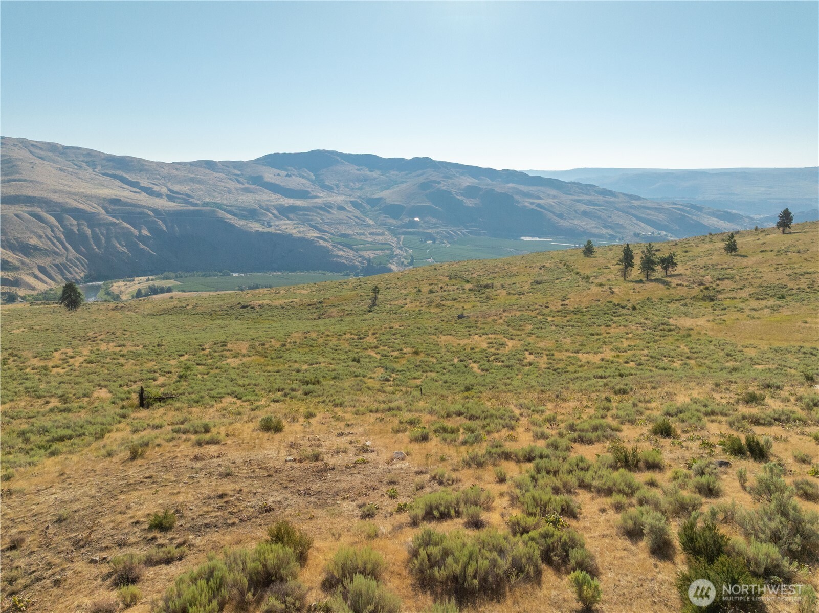 0 Goat Ridge, Unit 6 Pateros, WA 98846 - Photo 31 of 39 a view of a large mountain with mountains in the background