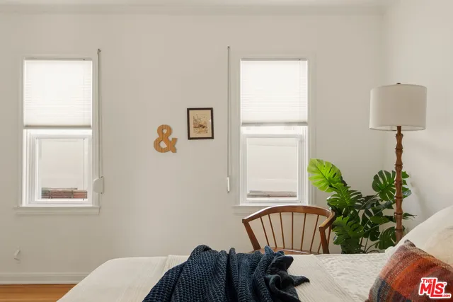 a bed room with a bed and a dresser