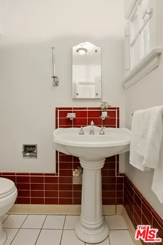 a bathroom with a sink and a shower curtain