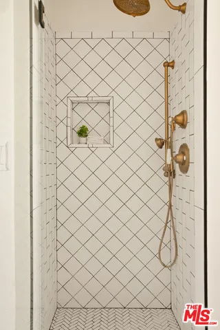 a view of a patio with table and chairs