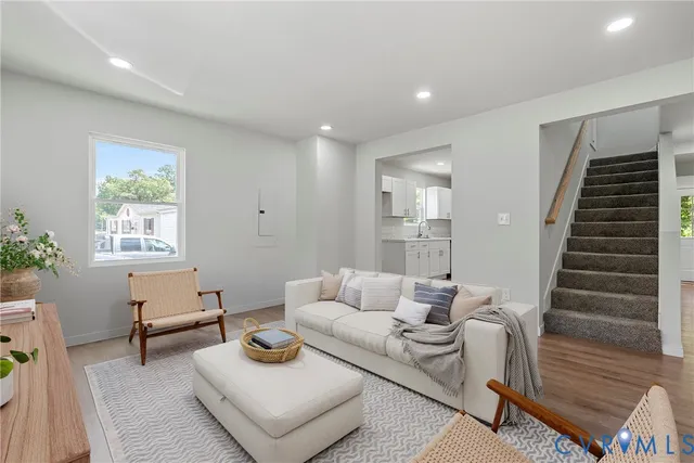 a living room with furniture and a window