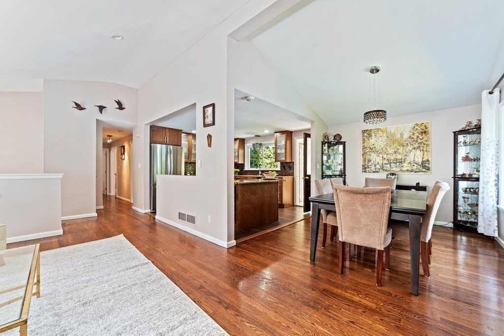 545 Potter Road Framingham, MA 01701 - Photo 16 of 42 a view of a dining room with furniture and wooden floor