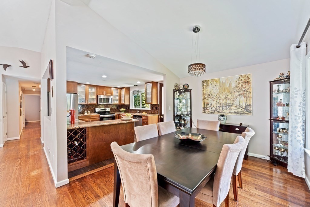 545 Potter Road Framingham, MA 01701 - Photo 17 of 42 a dining room with furniture and wooden floor