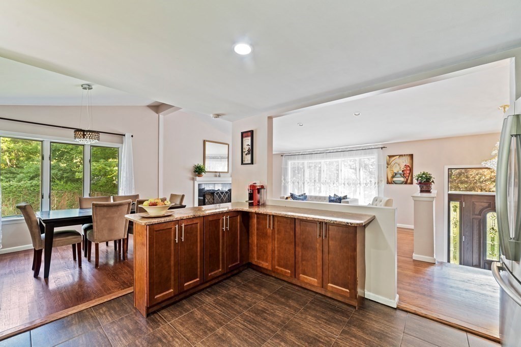 545 Potter Road Framingham, MA 01701 - Photo 21 of 42 a kitchen with lots of counter top space and dining table