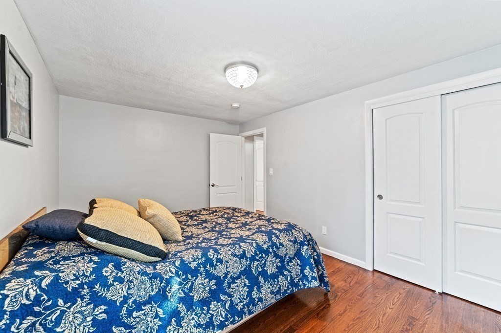 545 Potter Road Framingham, MA 01701 - Photo 28 of 42 a bedroom with a bed and a dresser