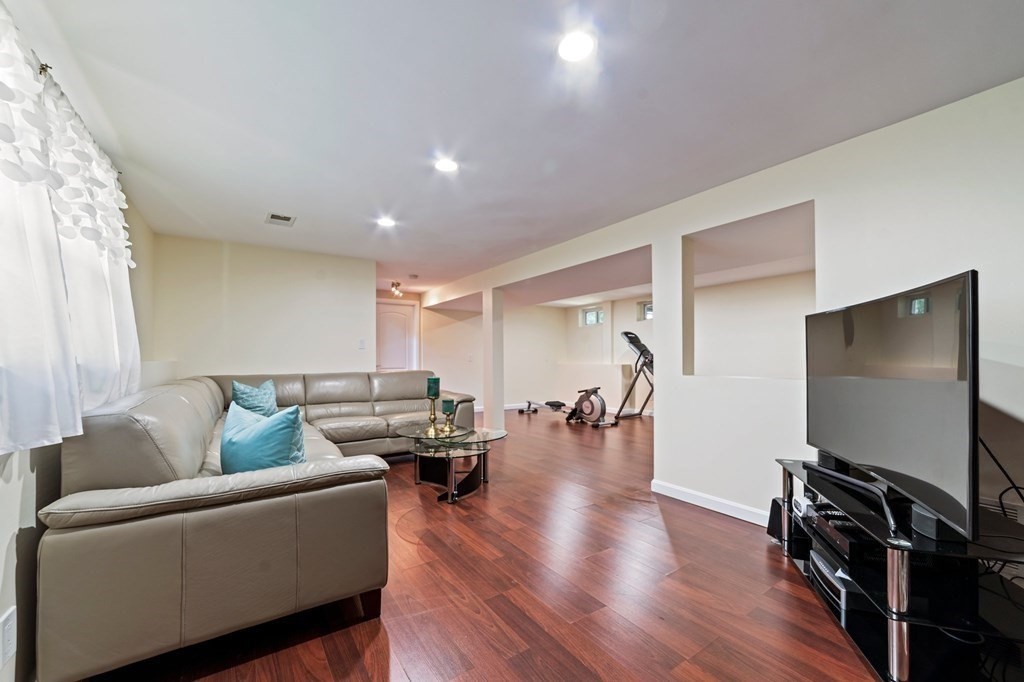 545 Potter Road Framingham, MA 01701 - Photo 30 of 42 a living room with furniture and a flat screen tv