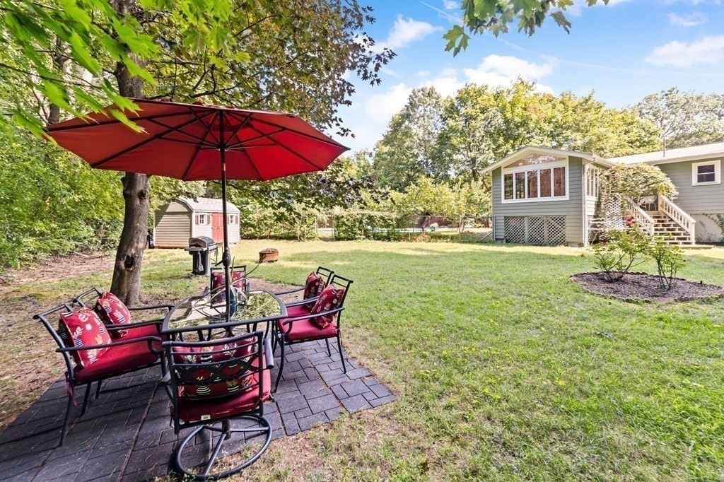 545 Potter Road Framingham, MA 01701 - Photo 34 of 42 a view of a house with backyard and sitting area