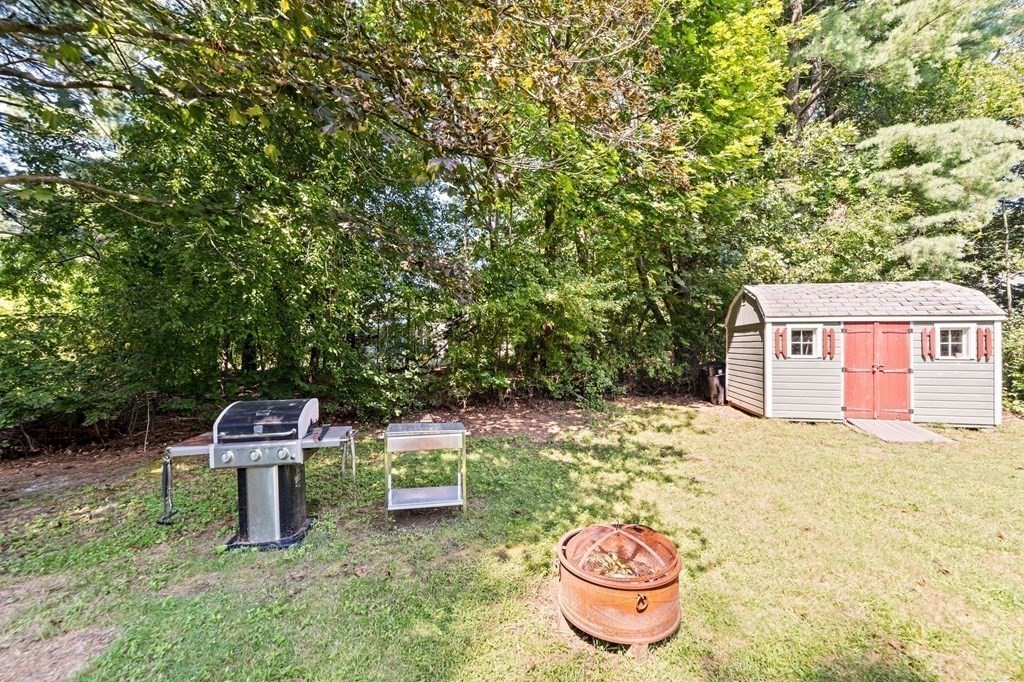 545 Potter Road Framingham, MA 01701 - Photo 35 of 42 a backyard of a house with table and chairs