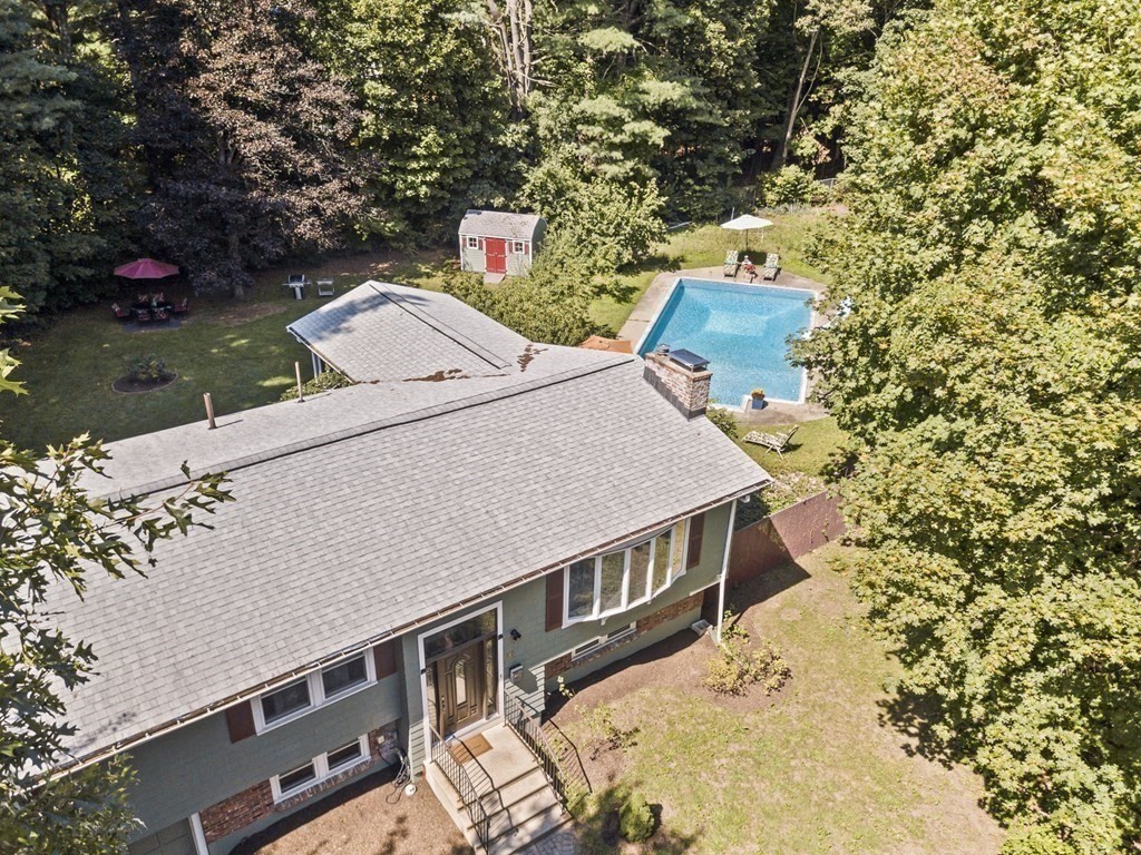 545 Potter Road Framingham, MA 01701 - Photo 39 of 42 a view of a balcony with two chairs and a fire pit