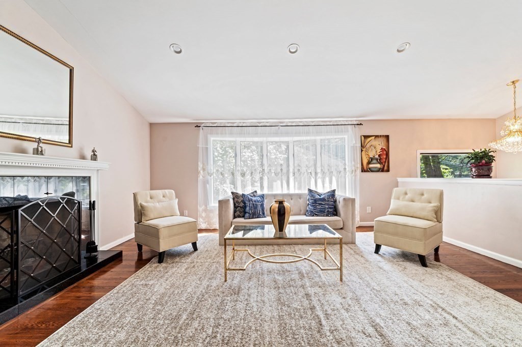 545 Potter Road Framingham, MA 01701 - Photo 4 of 42 a living room with furniture and a fireplace
