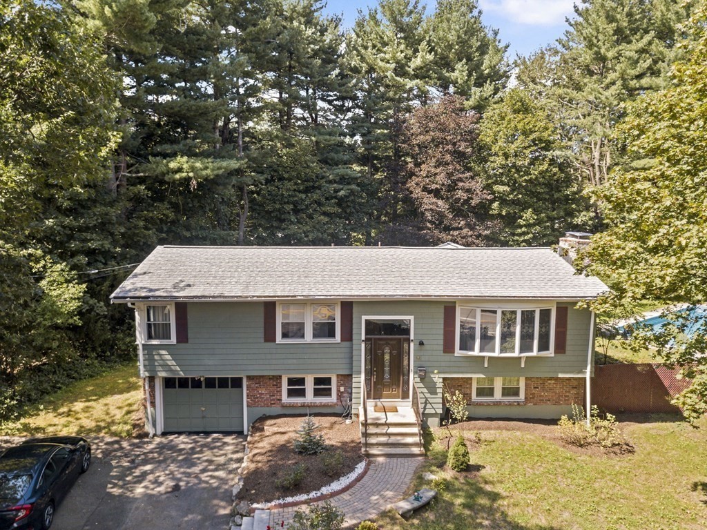545 Potter Road Framingham, MA 01701 - Photo 42 of 42 a front view of a house with a yard
