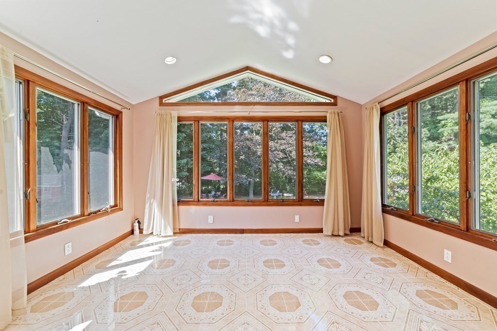 545 Potter Road Framingham, MA 01701 - Photo 8 of 42 a view of a big room with windows and entryway