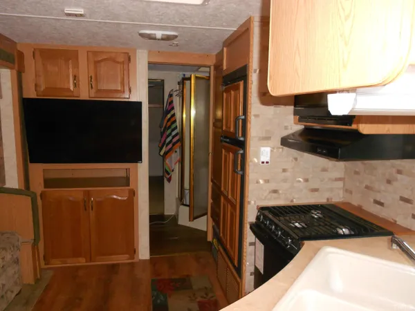 a kitchen with a stove and a microwave