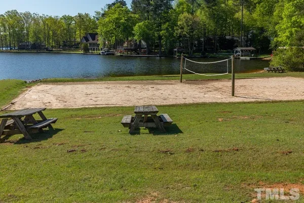 a view of a backyard with swimming pool