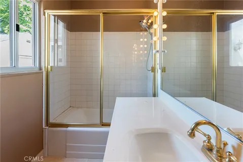 a bathroom with a bathtub and a shower