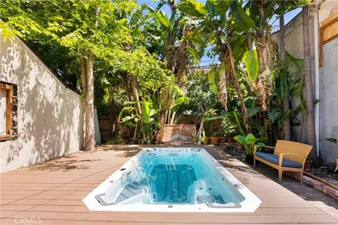 a backyard of a house with barbeque oven