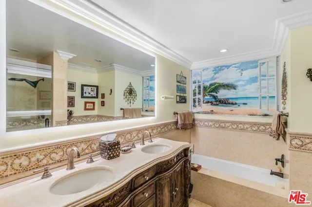 a bathroom with a sink a mirror and a bathtub