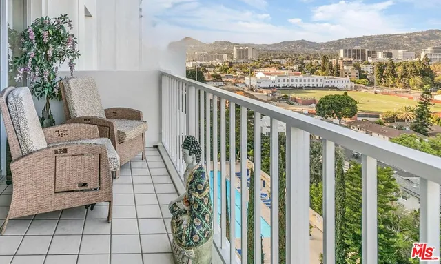 a view of balcony with furniture