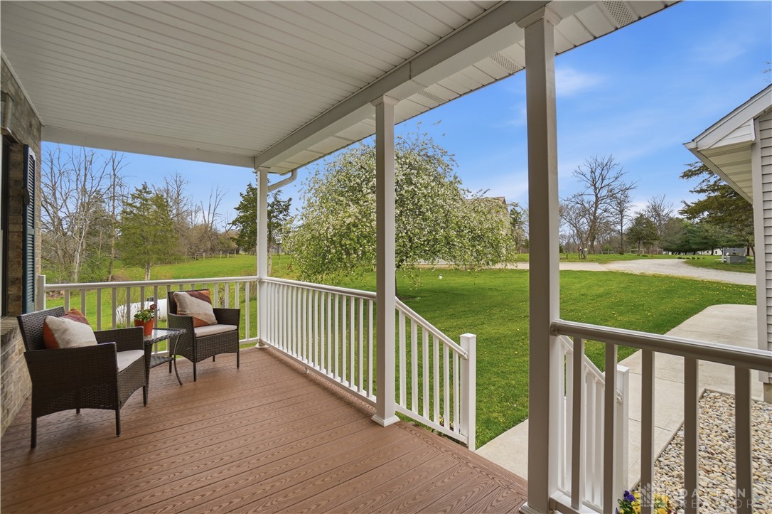 7553 Coffin Station Road Springfield, OH 45502 - Photo 14 of 95 Enjoy tranquil views from this welcoming porch, perfect for relaxing outdoors.