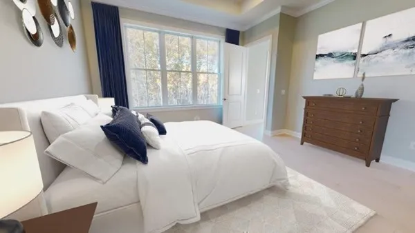 a bedroom with a bed and window