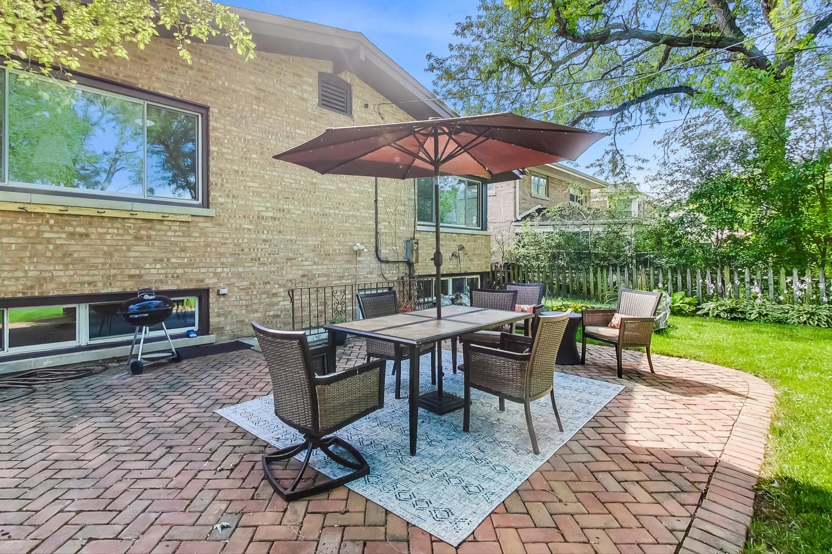 8948 Forestview Road Evanston, IL 60203 - Photo 34 of 37 a patio with a patio table and chairs