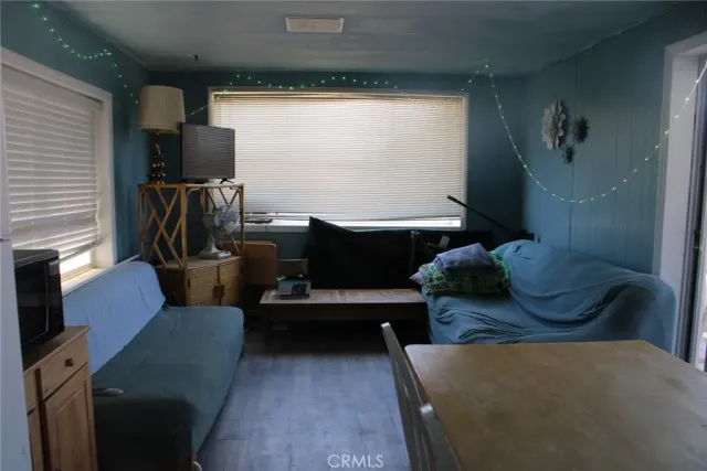 a living room with furniture fireplace and flat screen tv