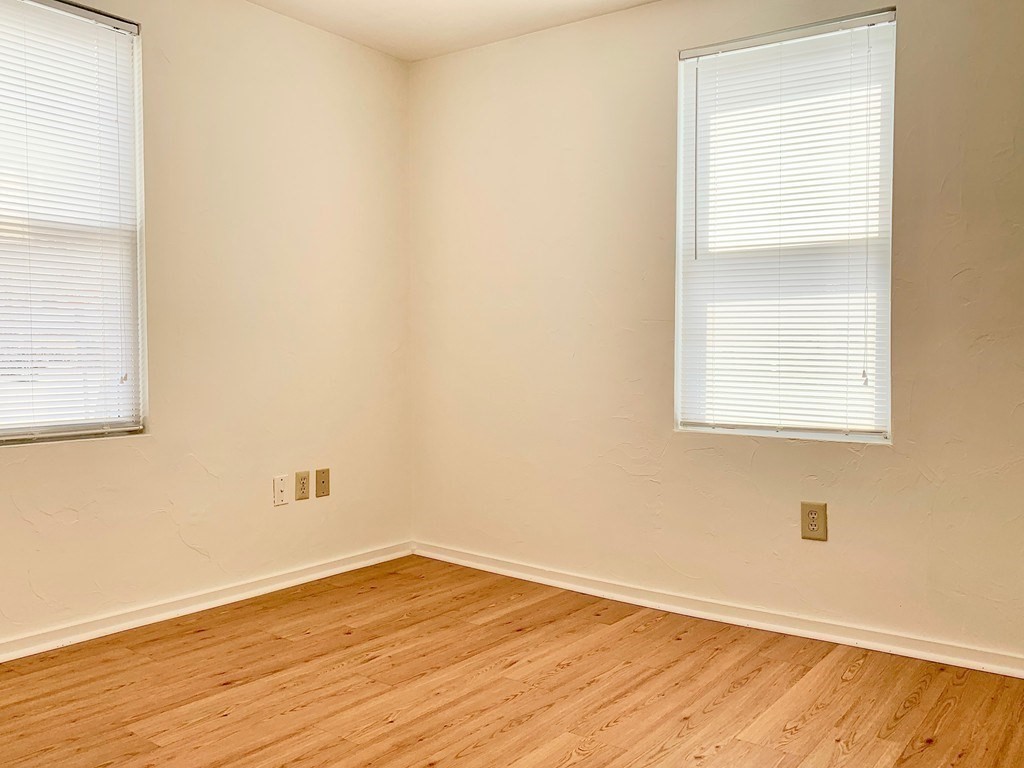 14 Groton Street, Unit 6 Ayer, MA 01432 - Photo 5 of 7 an empty room with wooden floor and windows