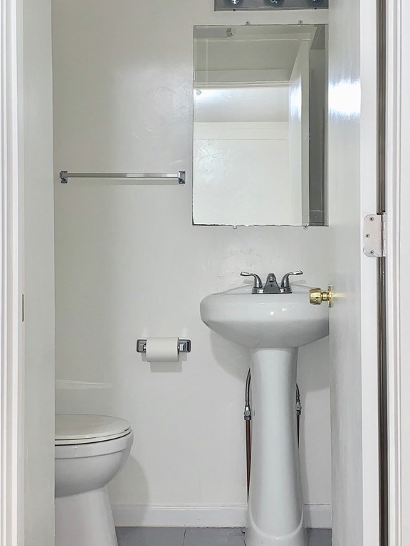 14 Groton Street, Unit 6 Ayer, MA 01432 - Photo 7 of 7 a bathroom with a sink toilet and mirror