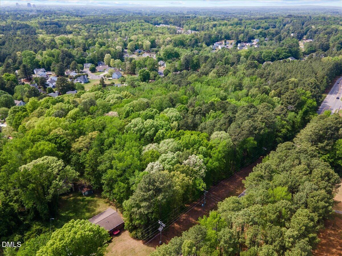 631-633 Clayton Road Durham, NC 27703 - Photo 4 of 17 an aerial view of a forest with houses