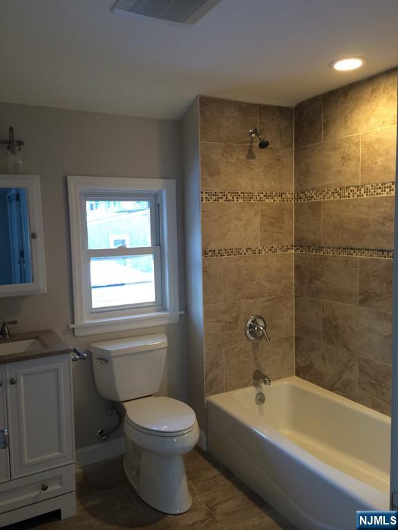 66 Stuart Street, Unit B Waldwick, NJ 07463 - Photo 8 of 11 a bathroom with a bathtub and a toilet