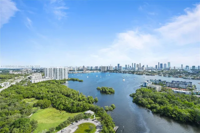 an aerial view of a city and lake view