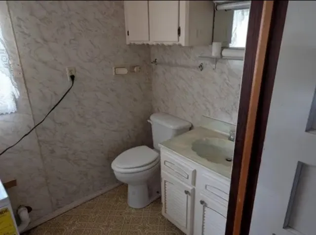 a bathroom with a sink and a washing machine