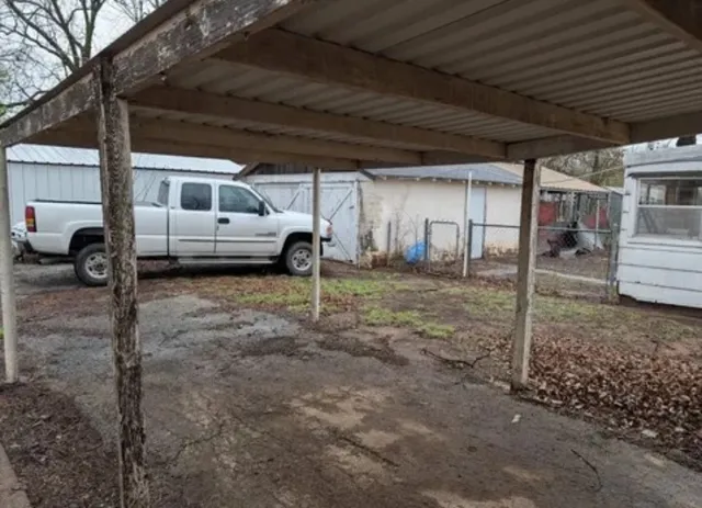 a view of a house with a backyard