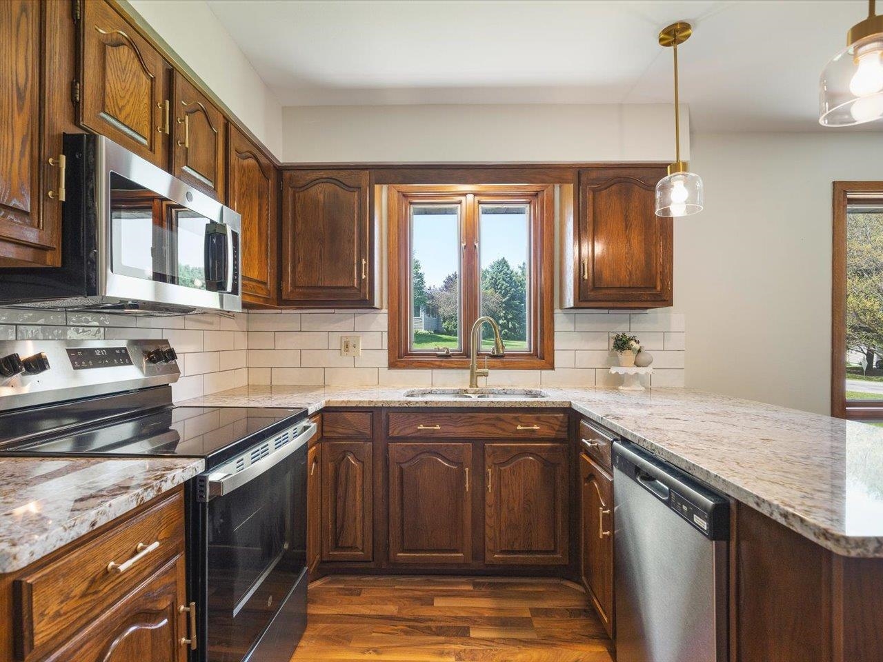 136 Lake Summerset Road Lake Summerset, IL 61019 - Photo 6 of 47 a kitchen with stainless steel appliances granite countertop a sink stove and cabinets