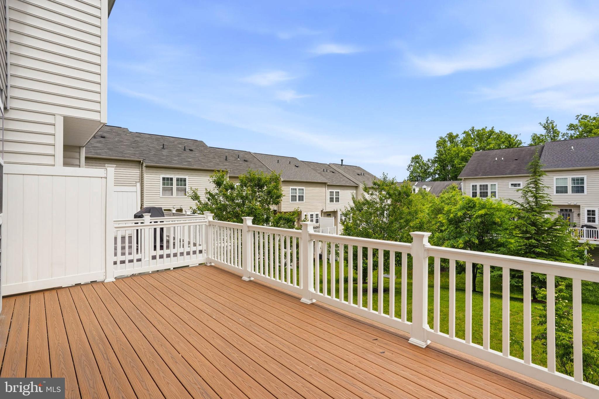 9817 Solar Course Laurel, MD 20723 - Photo 34 of 59 a balcony with wooden floor and fence