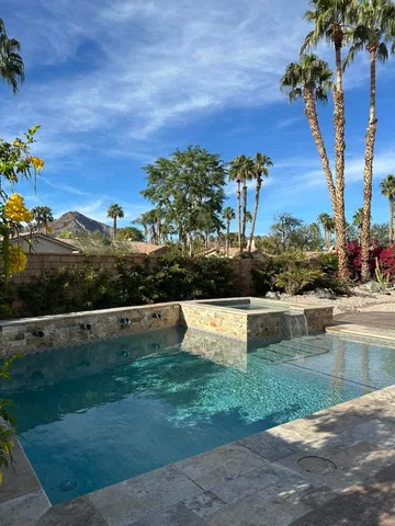 a view of a garden with a lake