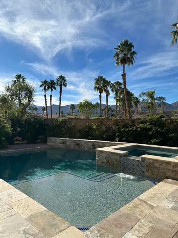 a view of a lake with a house in the background