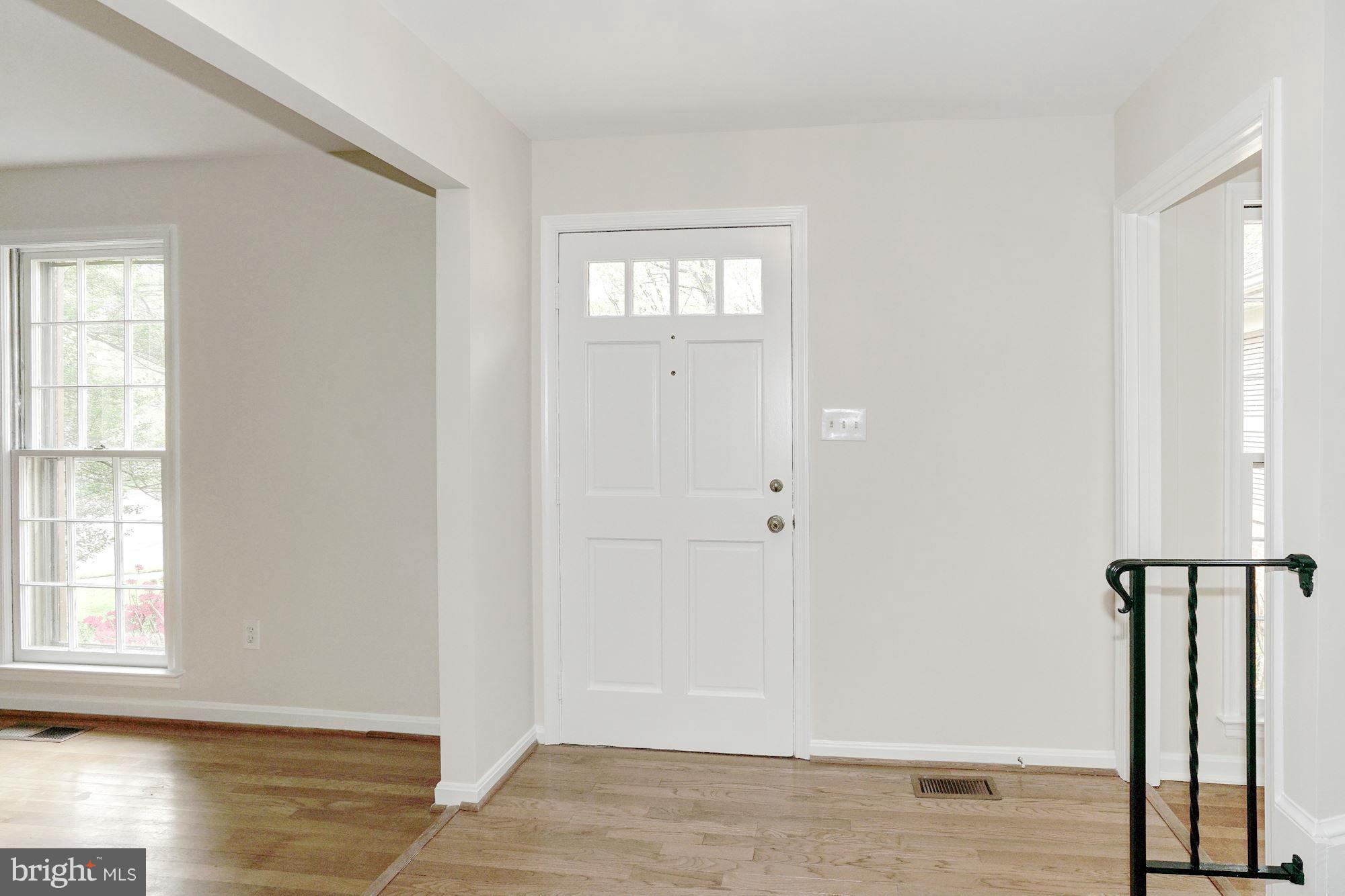 11037 Ring Road Reston, VA 20190 - Photo 2 of 30 a view of empty room with wooden floor and window