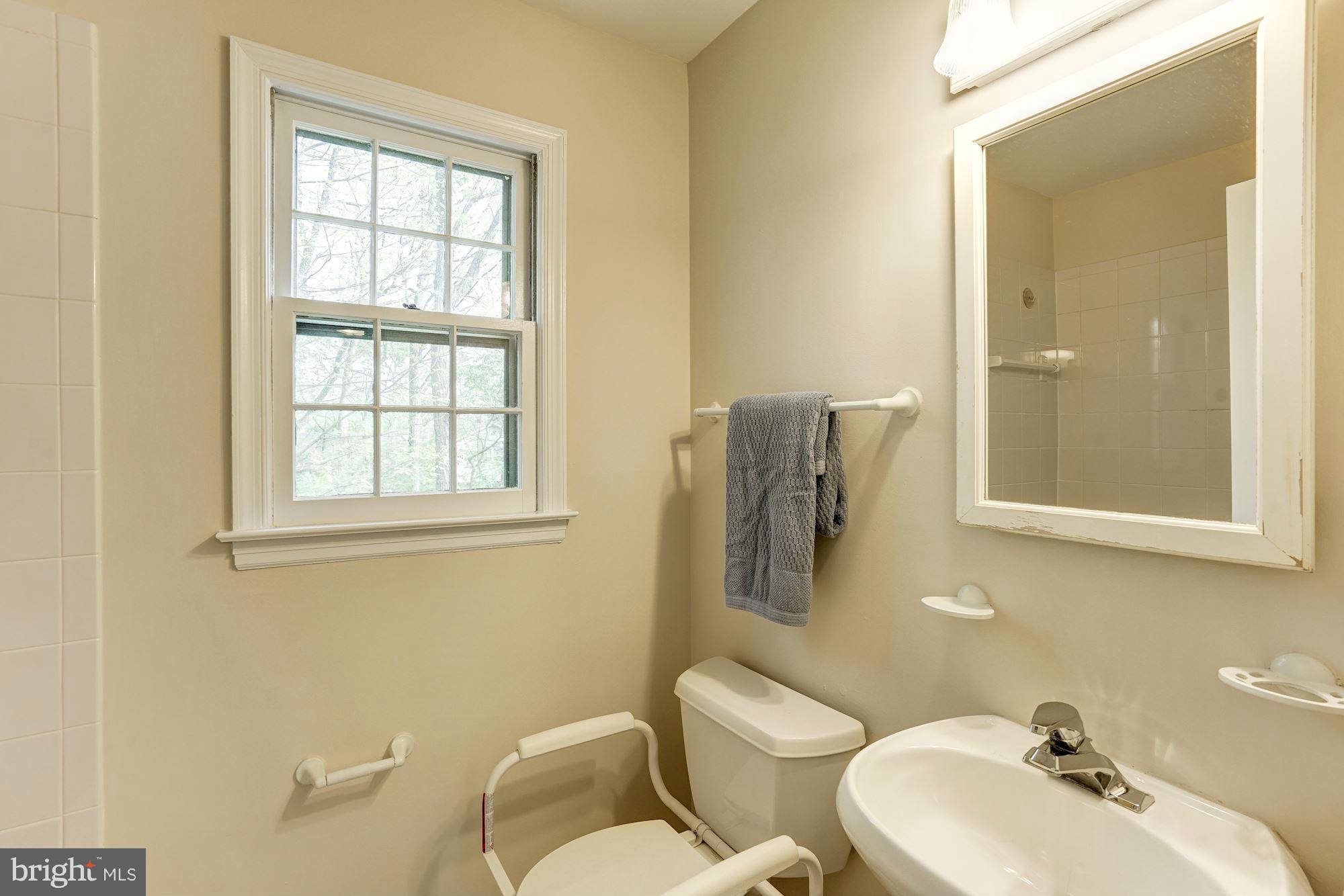 11037 Ring Road Reston, VA 20190 - Photo 12 of 30 a bathroom with a sink mirror and toilet