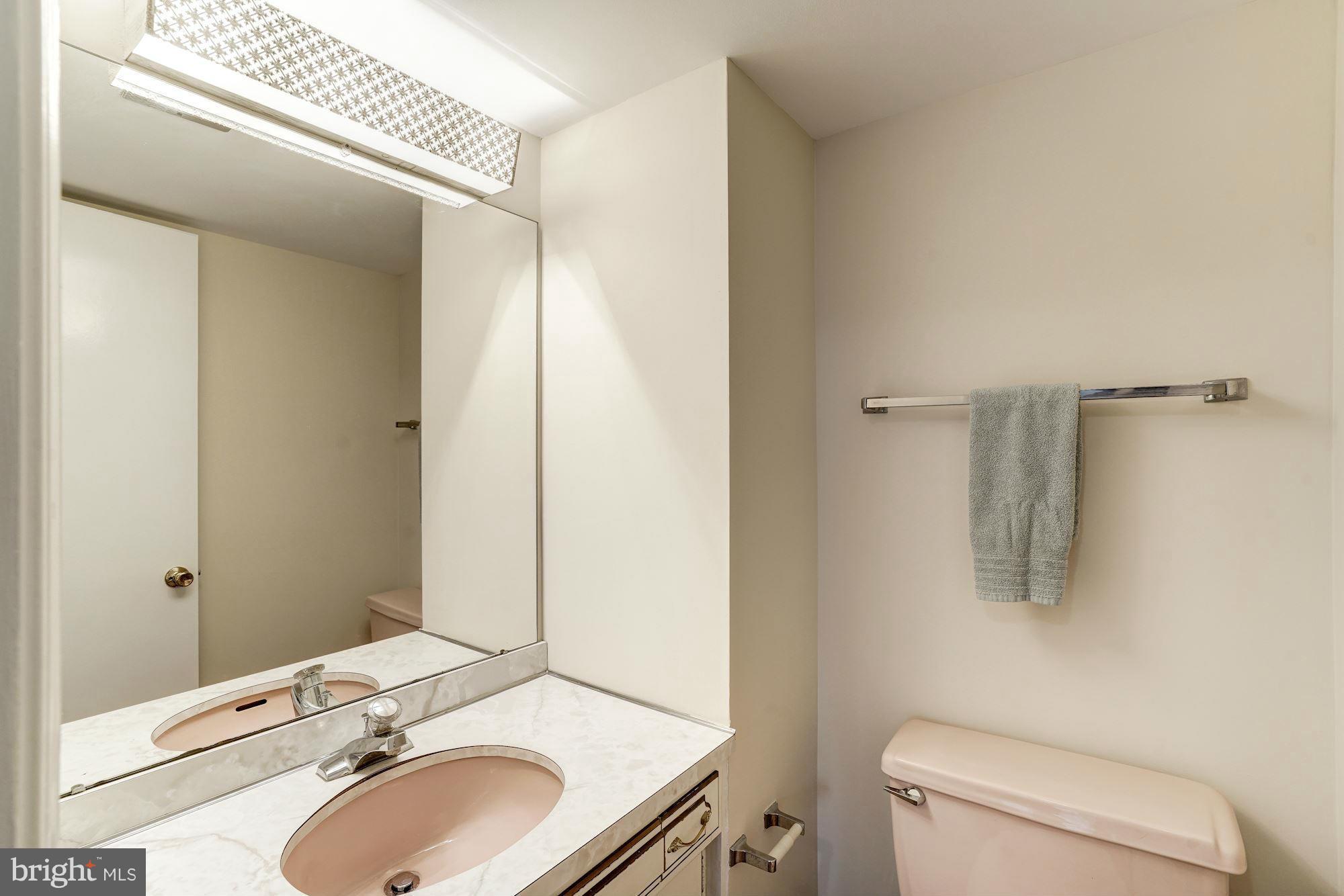 11037 Ring Road Reston, VA 20190 - Photo 14 of 30 a bathroom with a sink toilet and mirror