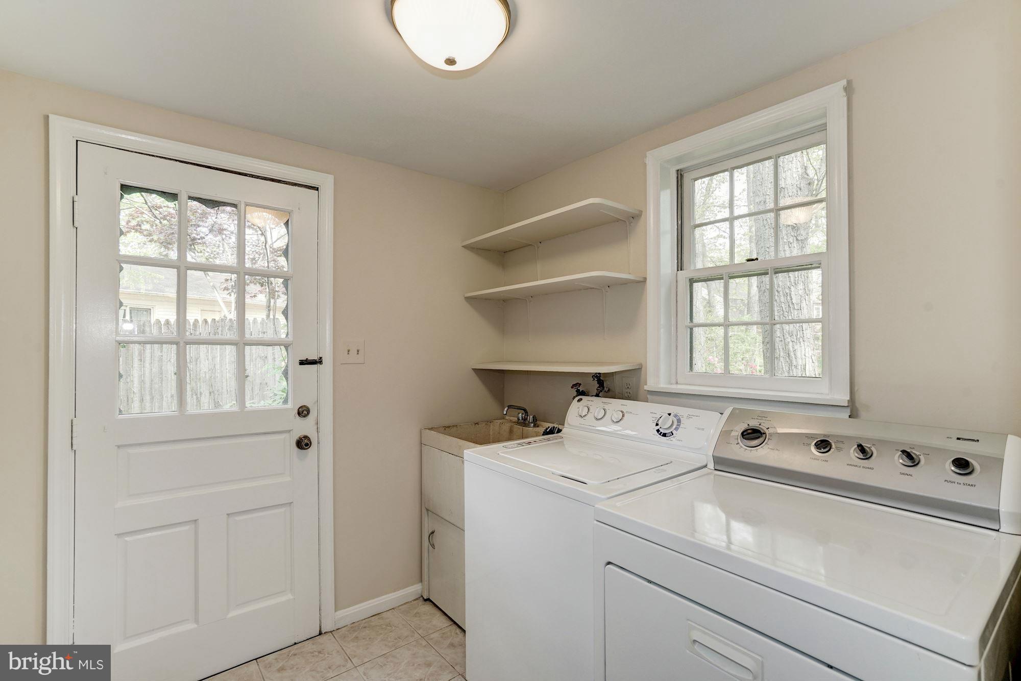 11037 Ring Road Reston, VA 20190 - Photo 17 of 30 a utility room with dryer and washer