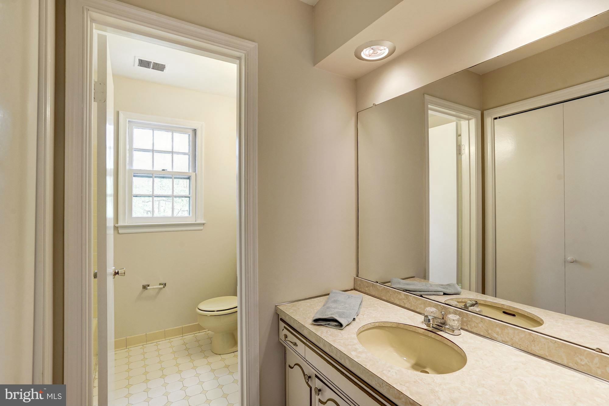 11037 Ring Road Reston, VA 20190 - Photo 18 of 30 a bathroom with a sink toilet and shower
