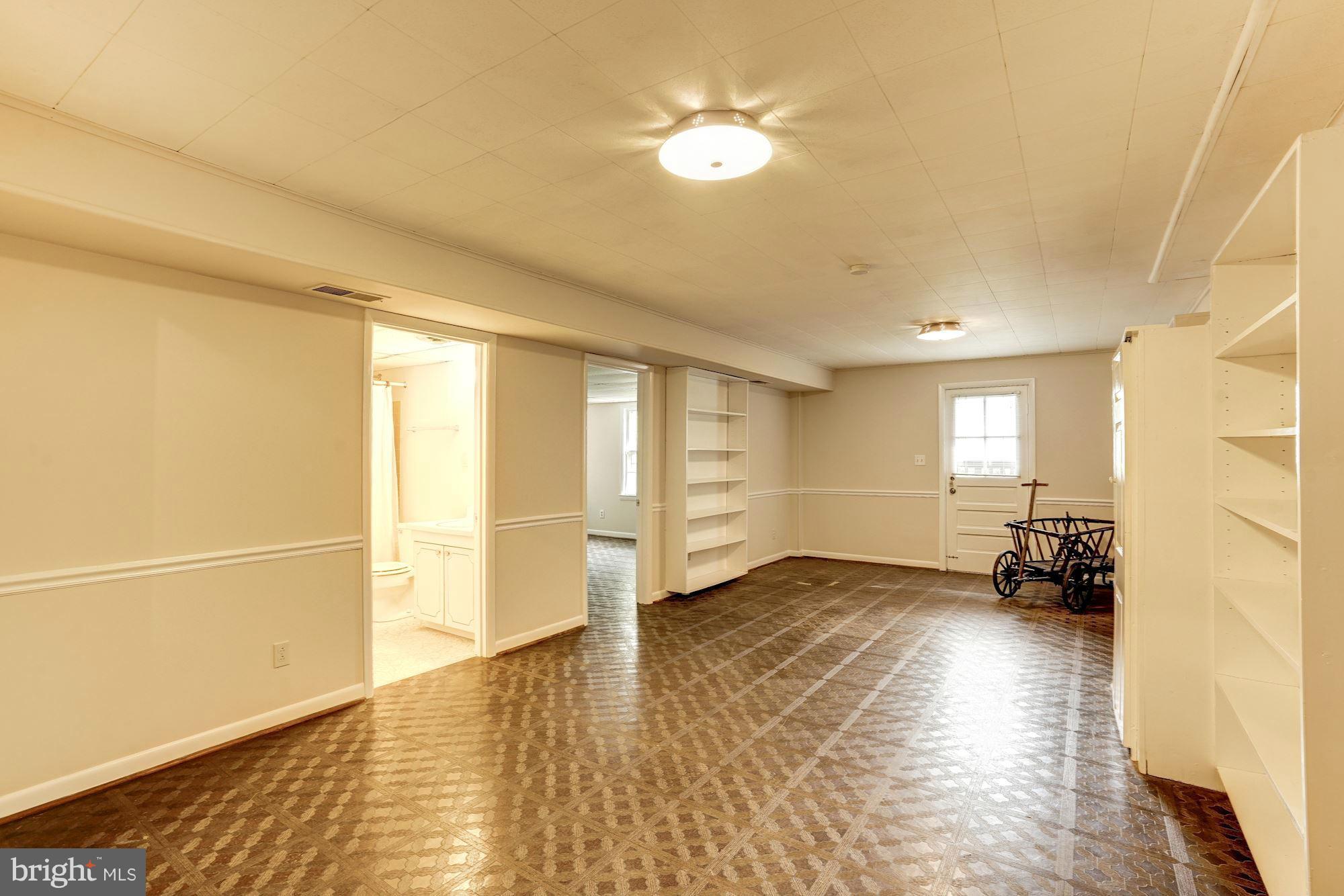 11037 Ring Road Reston, VA 20190 - Photo 22 of 30 a view of empty room with wooden floor and fan