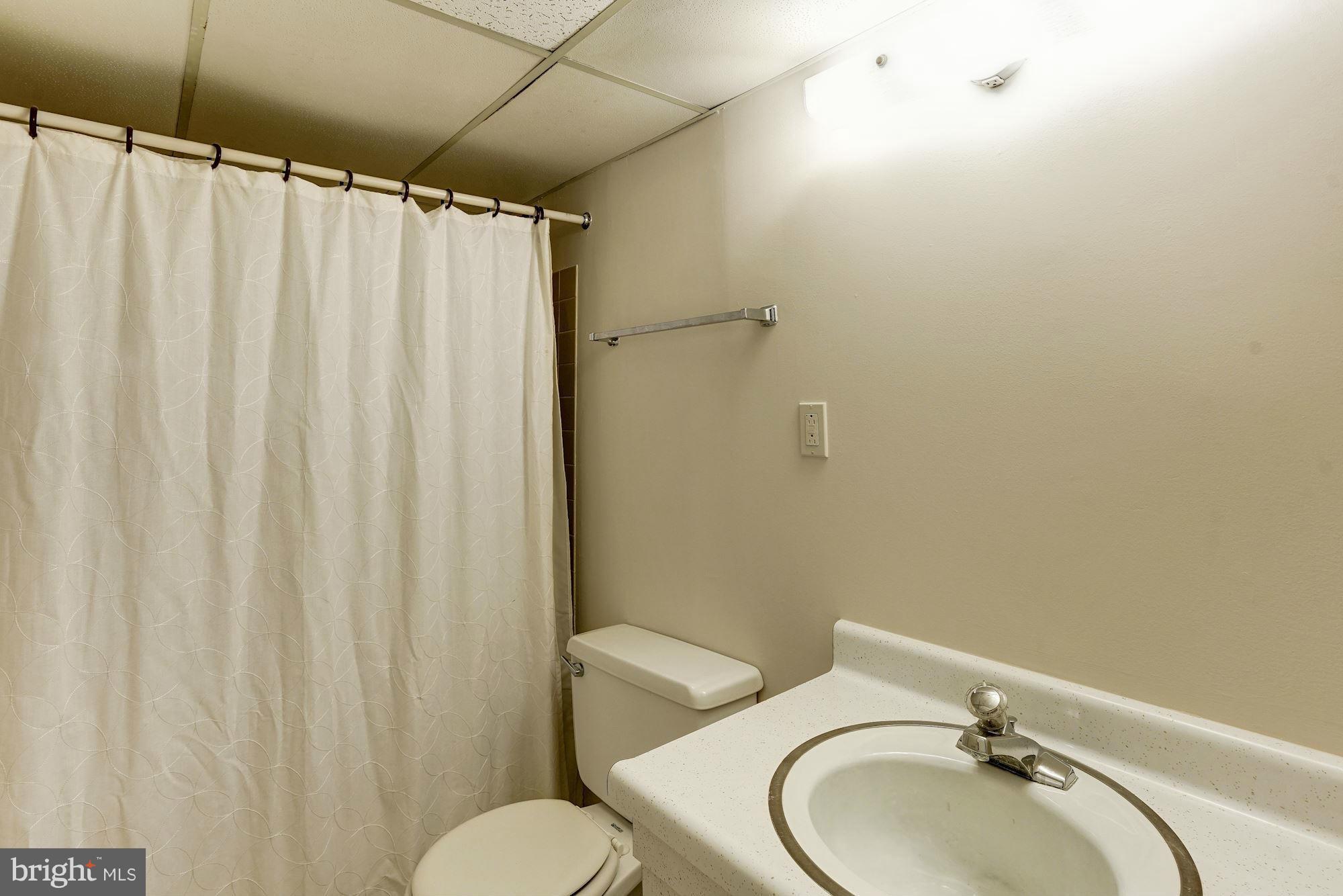 11037 Ring Road Reston, VA 20190 - Photo 25 of 30 a bathroom with a sink and a mirror