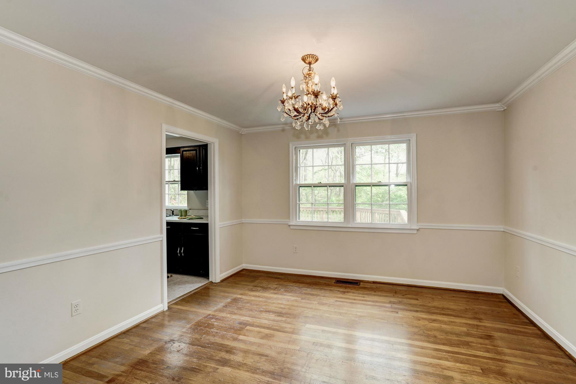 11037 Ring Road Reston, VA 20190 - Photo 5 of 30 wooden floor in an empty room with a window